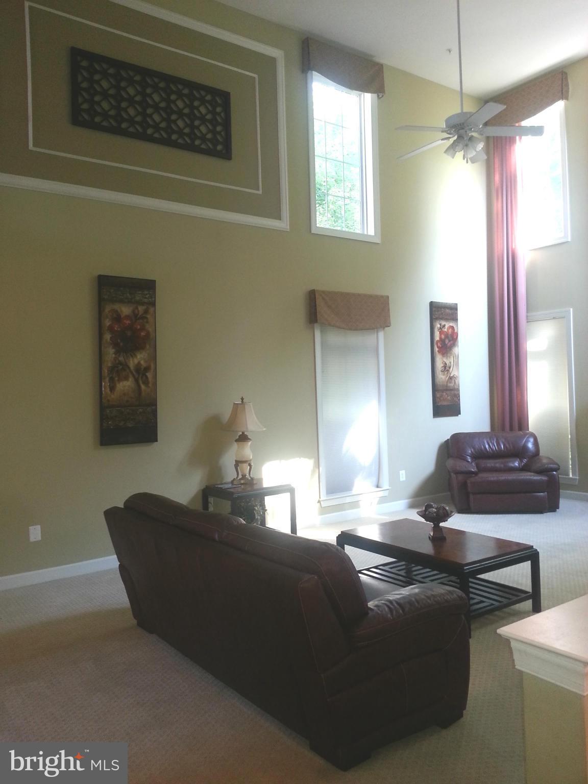 2000 Medinah Ridge Road Accokeek, MD 20607 - Photo 8 of 20 a living room with furniture and a chandelier