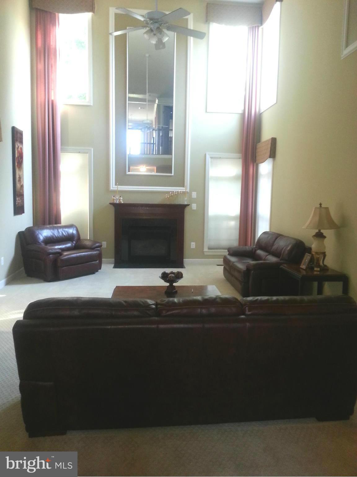 2000 Medinah Ridge Road Accokeek, MD 20607 - Photo 9 of 20 a living room with furniture and a fireplace