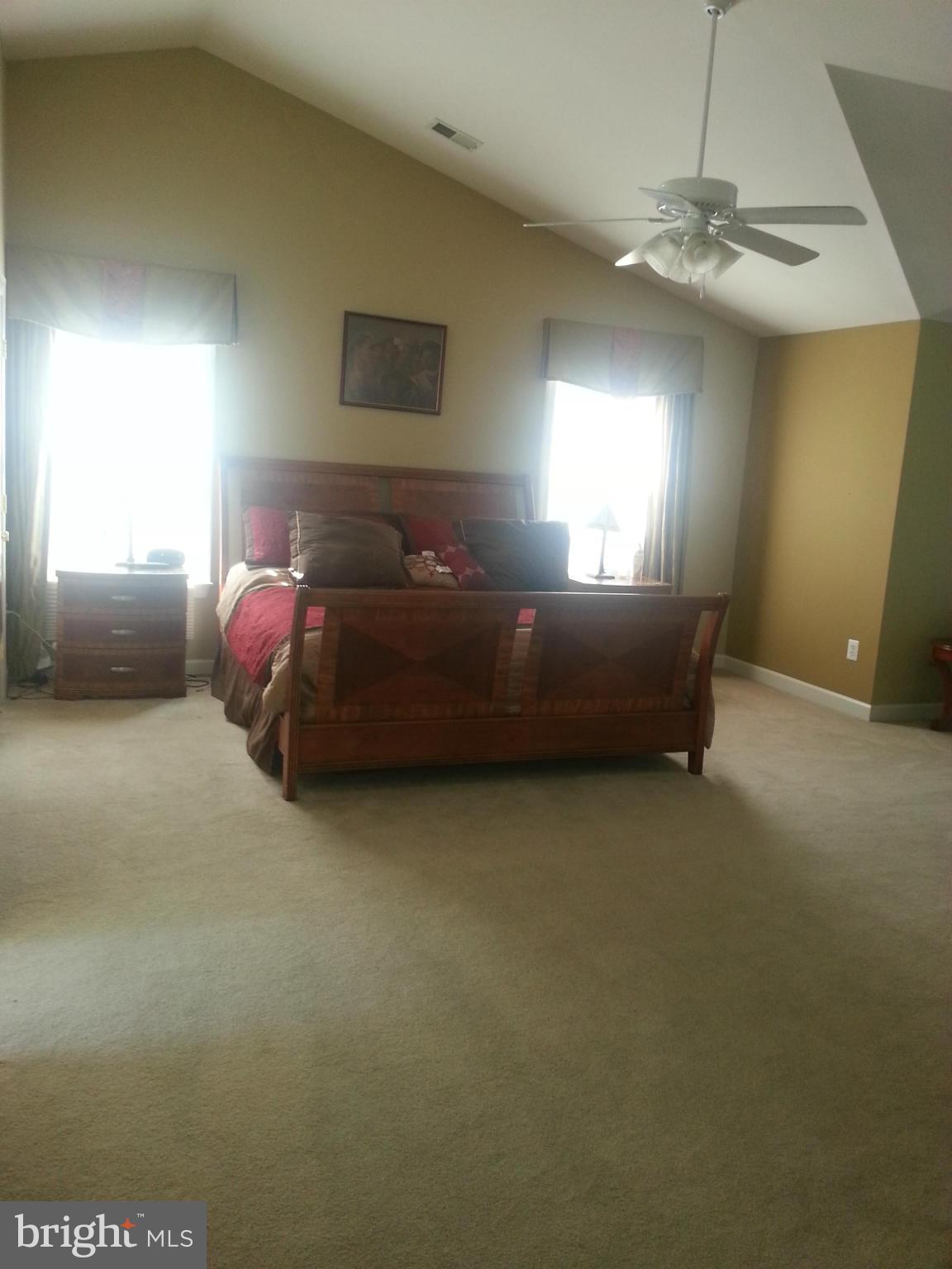 2000 Medinah Ridge Road Accokeek, MD 20607 - Photo 10 of 20 a living room with a bed furniture and a window