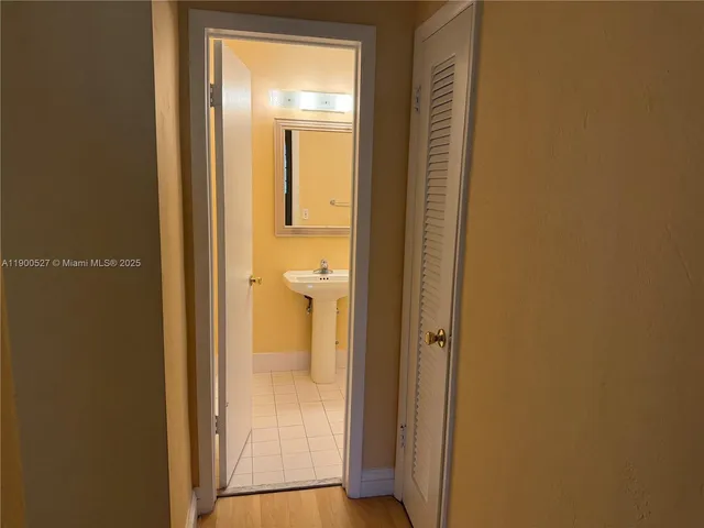 a view of a bathroom with a glass door