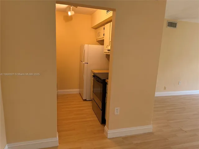 a view of a bathroom from a hallway