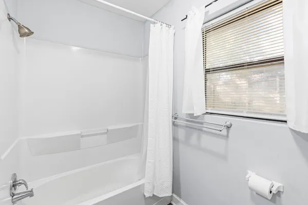 a kitchen with a sink cabinets and window