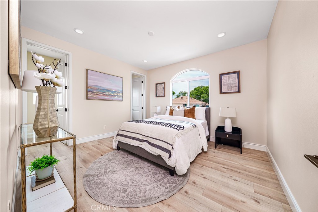 2709 Cogswell Road, Unit A El Monte, CA 91732 - Photo 13 of 57 a bedroom with a bed and wooden floor