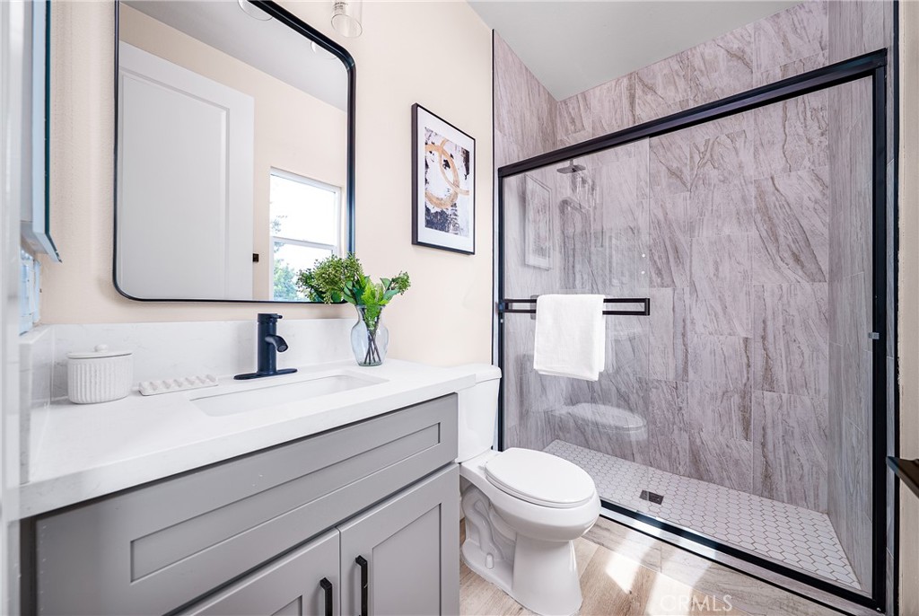2709 Cogswell Road, Unit A El Monte, CA 91732 - Photo 18 of 57 a bathroom with a sink a toilet and shower