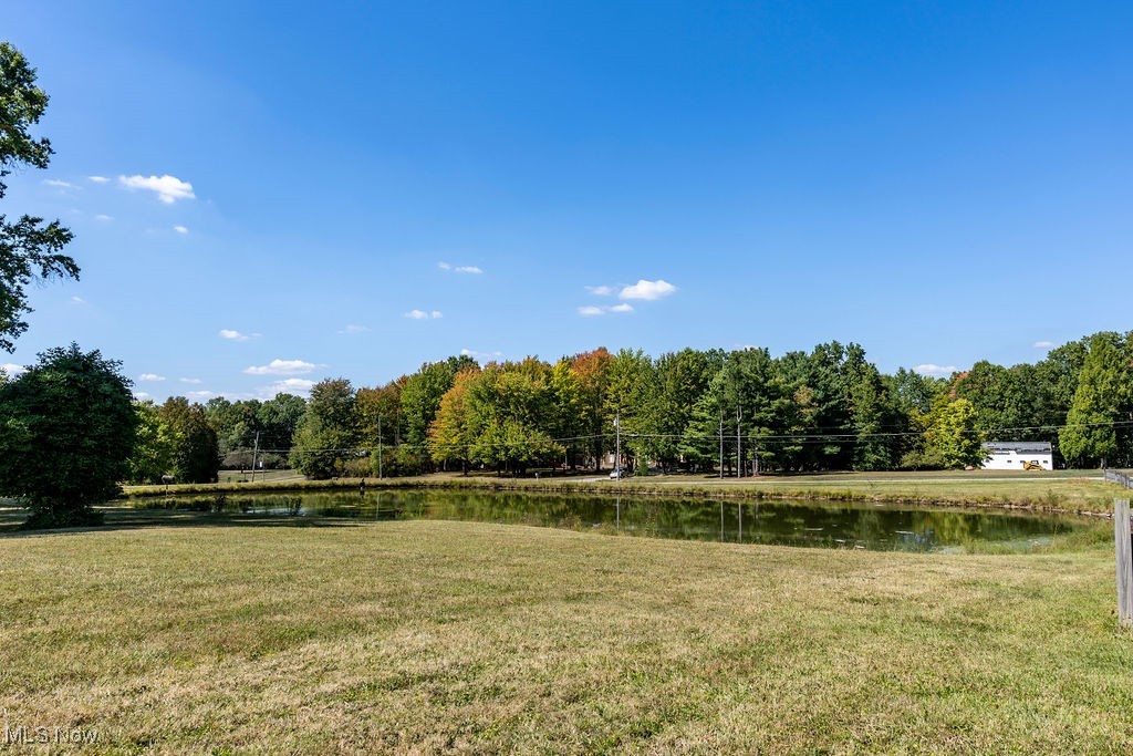 8131 Leffingwell Road Canfield, OH 44406 - Photo 13 of 37 View of green lawn featuring a water view