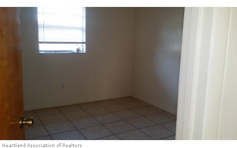 4103 Sparta Road Sebring, FL 33875 - Photo 4 of 6 a view of an empty room and window