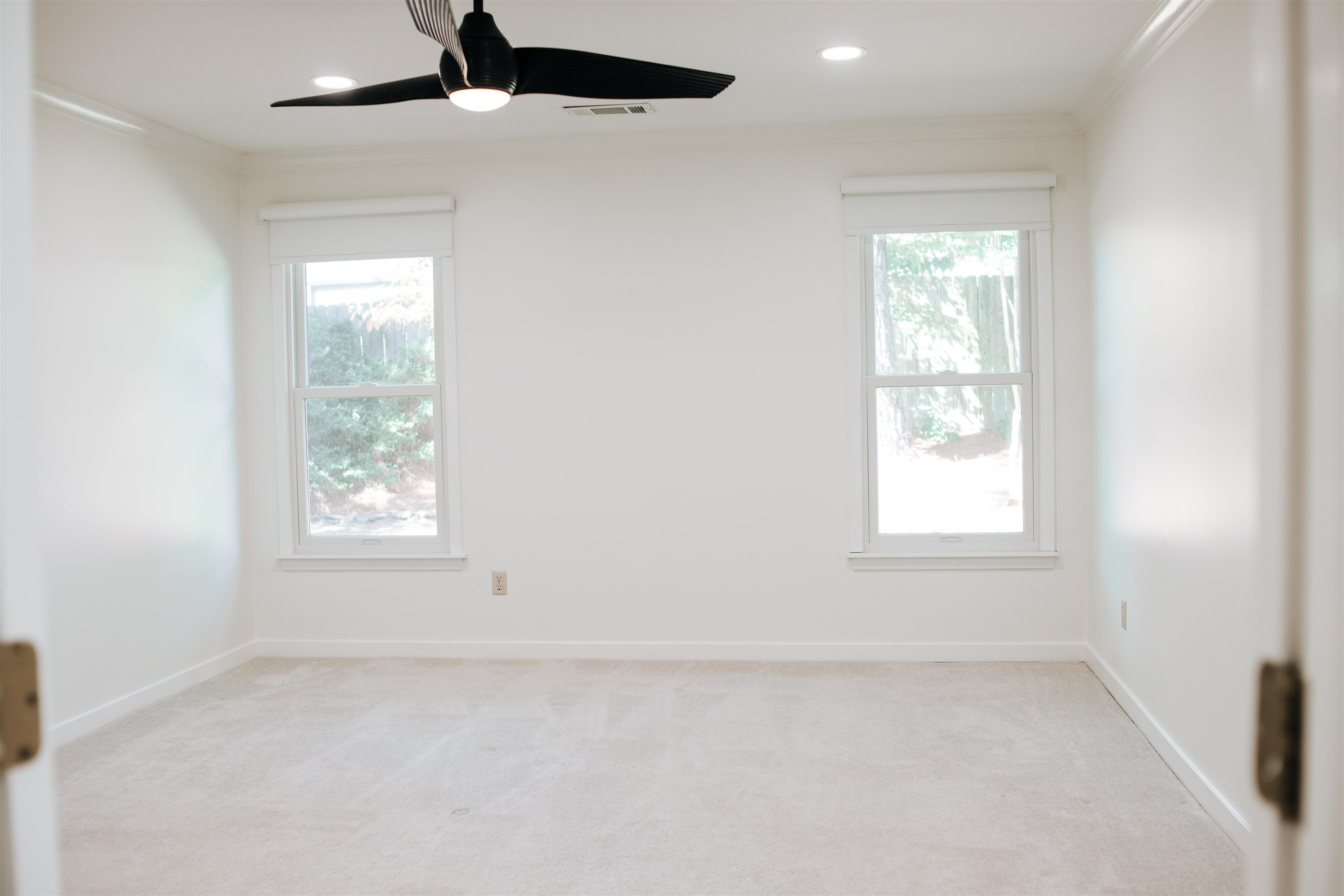1923 Rye Road Germantown, TN 38139 - Photo 26 of 34 Primary Bedroom featuring light colored carpet, healthy amount of natural light, ornamental molding, a ceiling fan, and recessed lighting