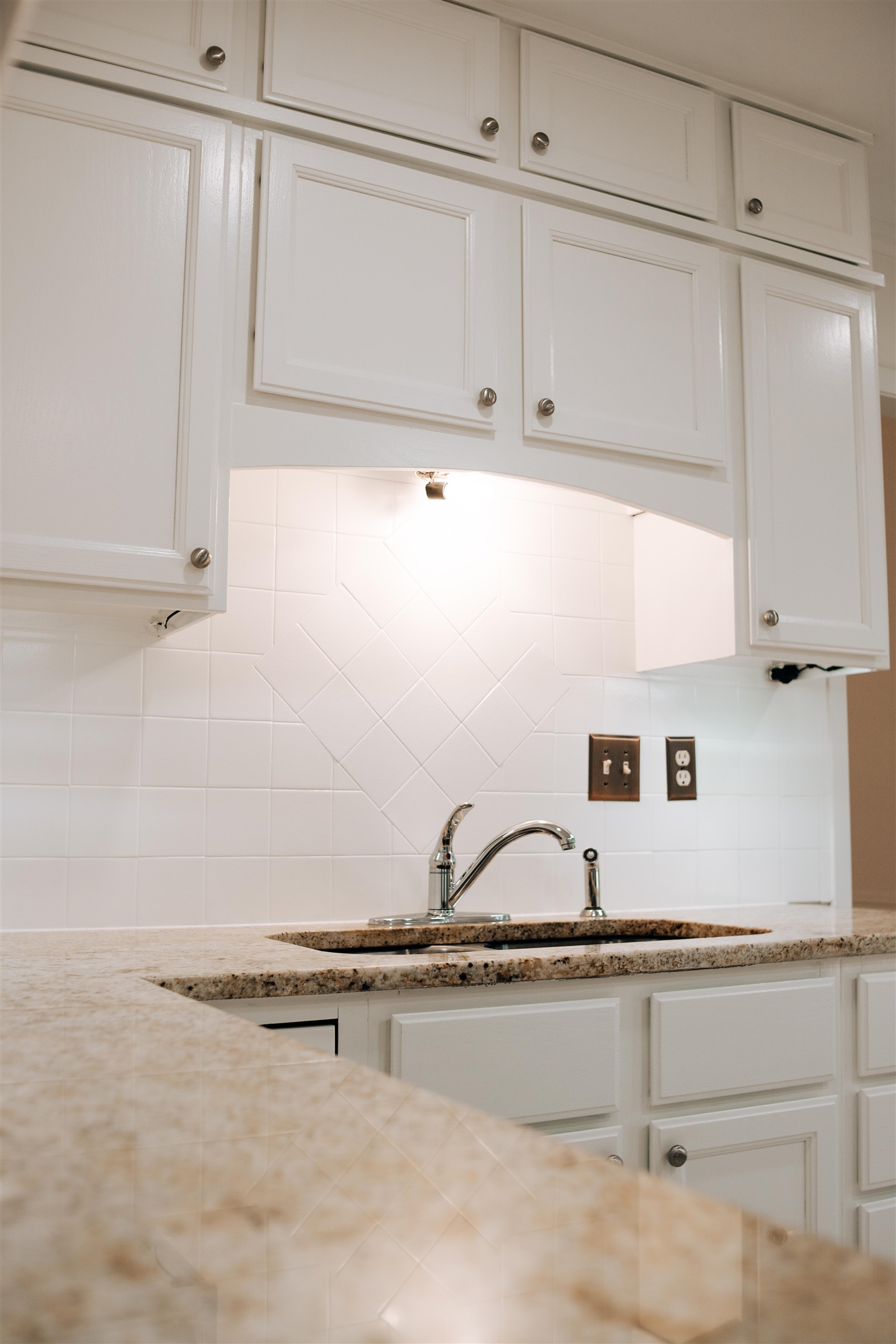 1923 Rye Road Germantown, TN 38139 - Photo 31 of 34 Kitchen featuring decorative backsplash, white cabinetry, and light stone counters