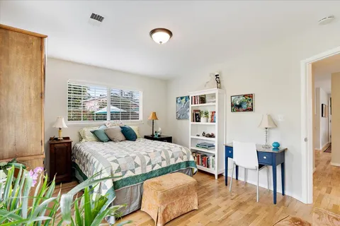 a bedroom with a bed furniture and a window