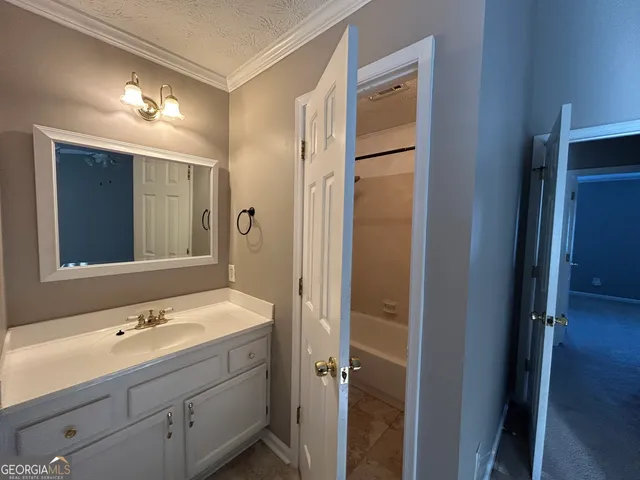a bathroom with a double vanity sink mirror and double