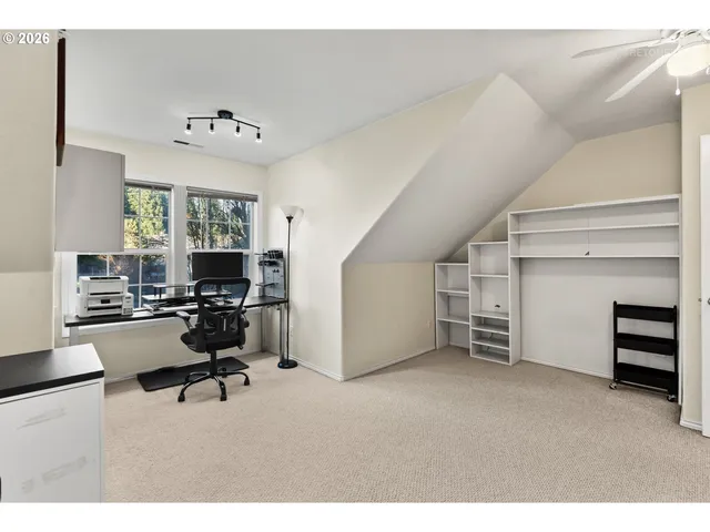 a bathroom with a sink vanity mirror and toilet