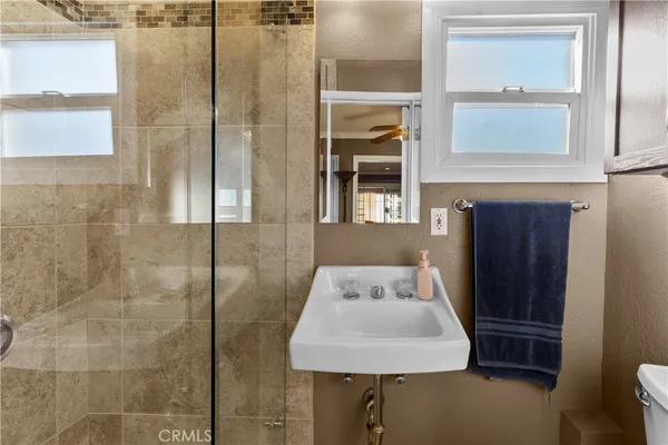 a bathroom with a sink and shower