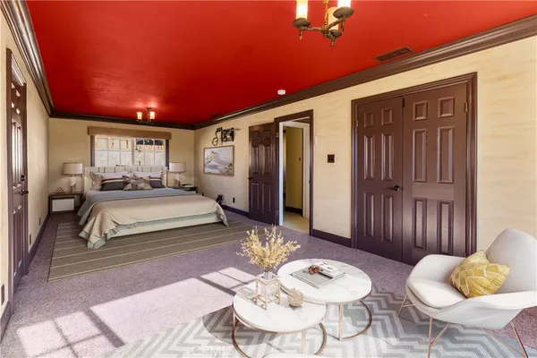 a bedroom with furniture and a wooden floor