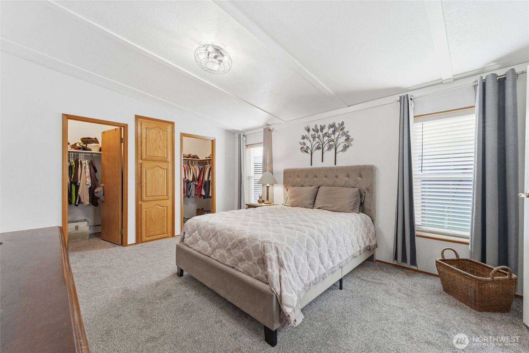 1352 Rancho Villa Walla Walla, WA 99362 - Photo 24 of 35 a spacious bedroom with a bed and a walk in closet