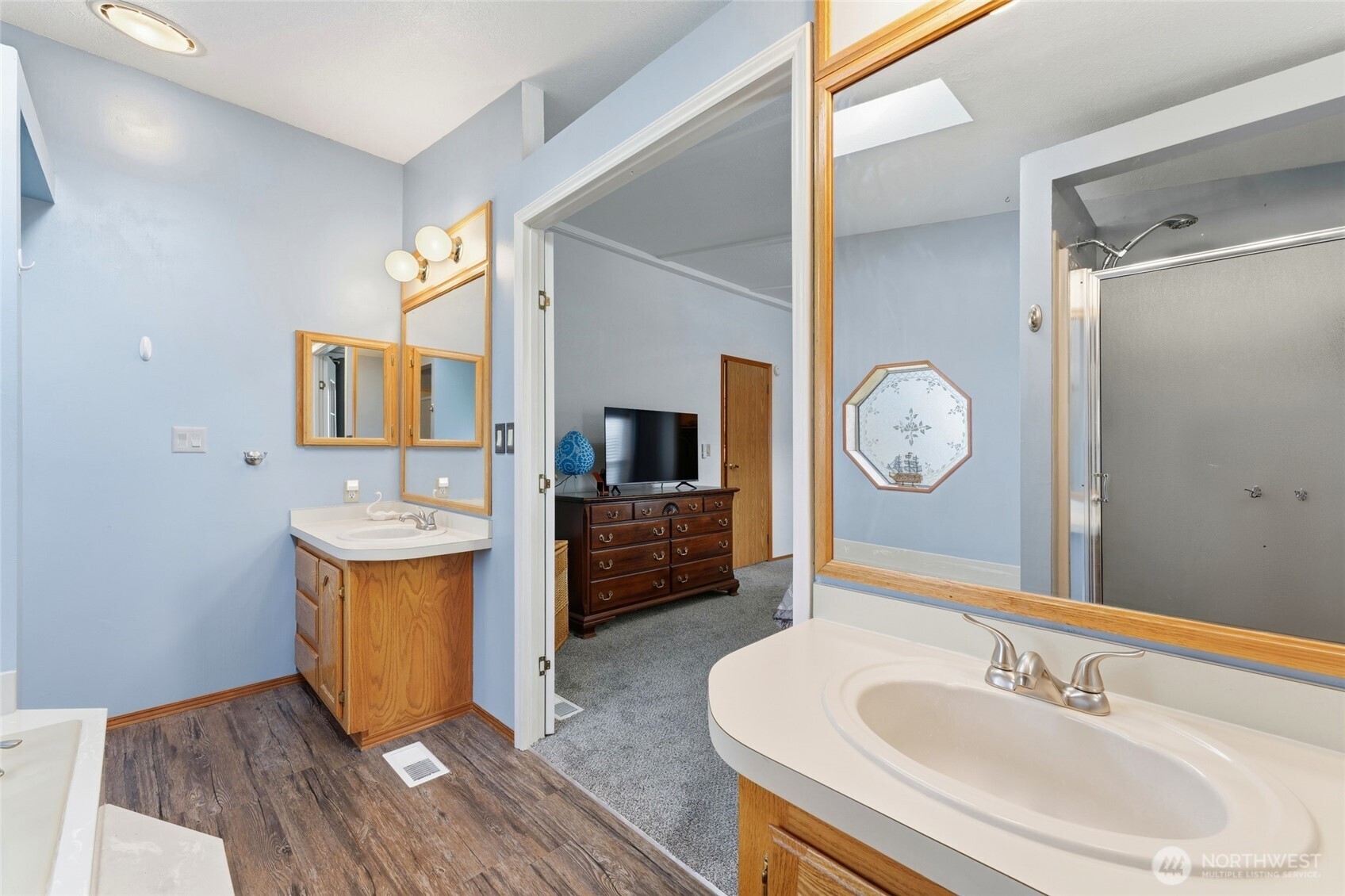 1352 Rancho Villa Walla Walla, WA 99362 - Photo 26 of 35 a bathroom with a sink a mirror and vanity