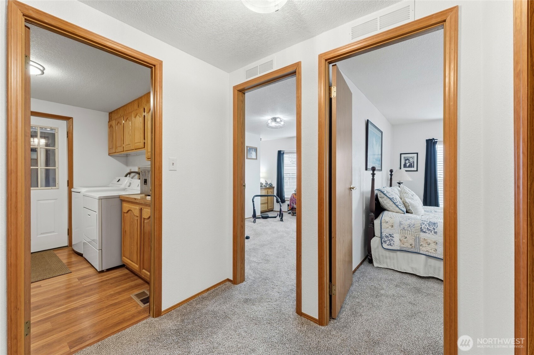 1352 Rancho Villa Walla Walla, WA 99362 - Photo 30 of 35 a view of a hallway with bathroom and wooden floor