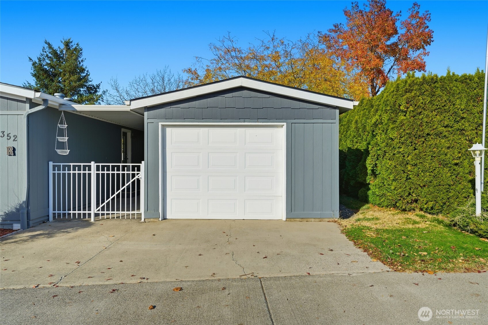 1352 Rancho Villa Walla Walla, WA 99362 - Photo 4 of 35 a view of a house with a small yard and potted plants