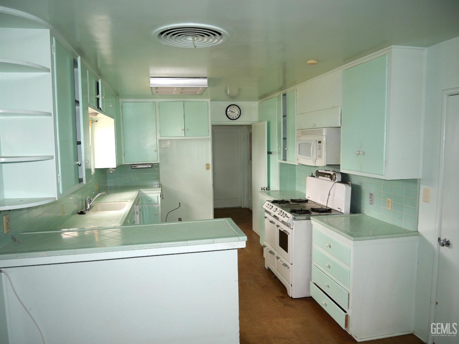 Undisclosed Address Delano, CA 93215 - Photo 3 of 7 a kitchen with a sink stove and refrigerator