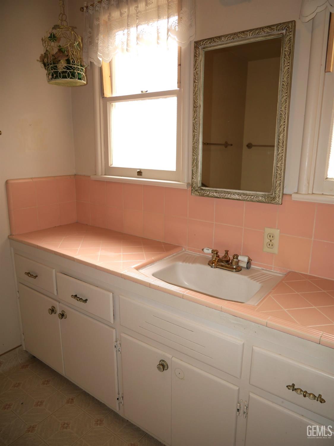 Undisclosed Address Delano, CA 93215 - Photo 6 of 7 a bathroom with a sink and a mirror