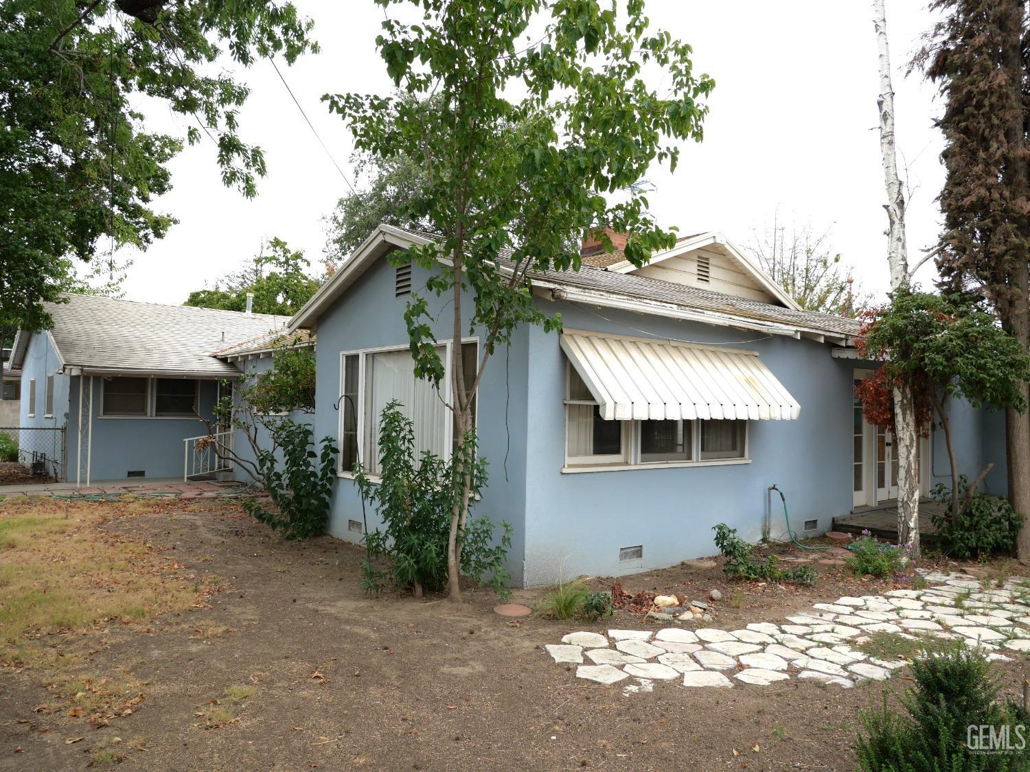 Undisclosed Address Delano, CA 93215 - Photo 7 of 7 a front view of a house with a tree