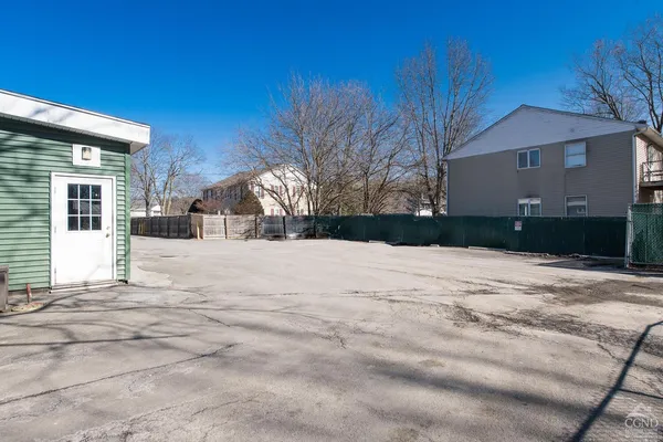 a view of garage yard and covered with snow