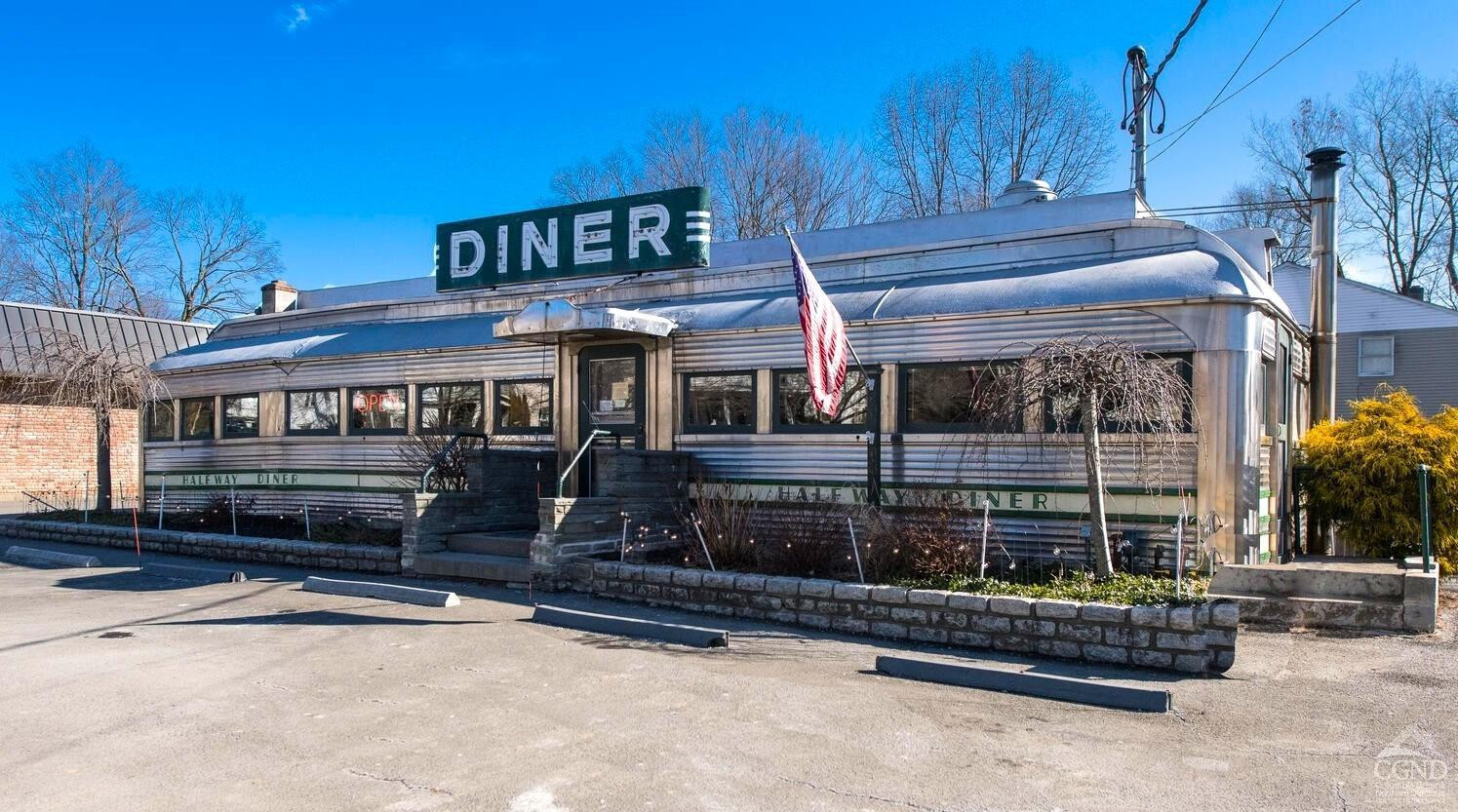 7550 North Broadway Red Hook, NY 12571 - Photo 18 of 19 a front view of a house with a garage