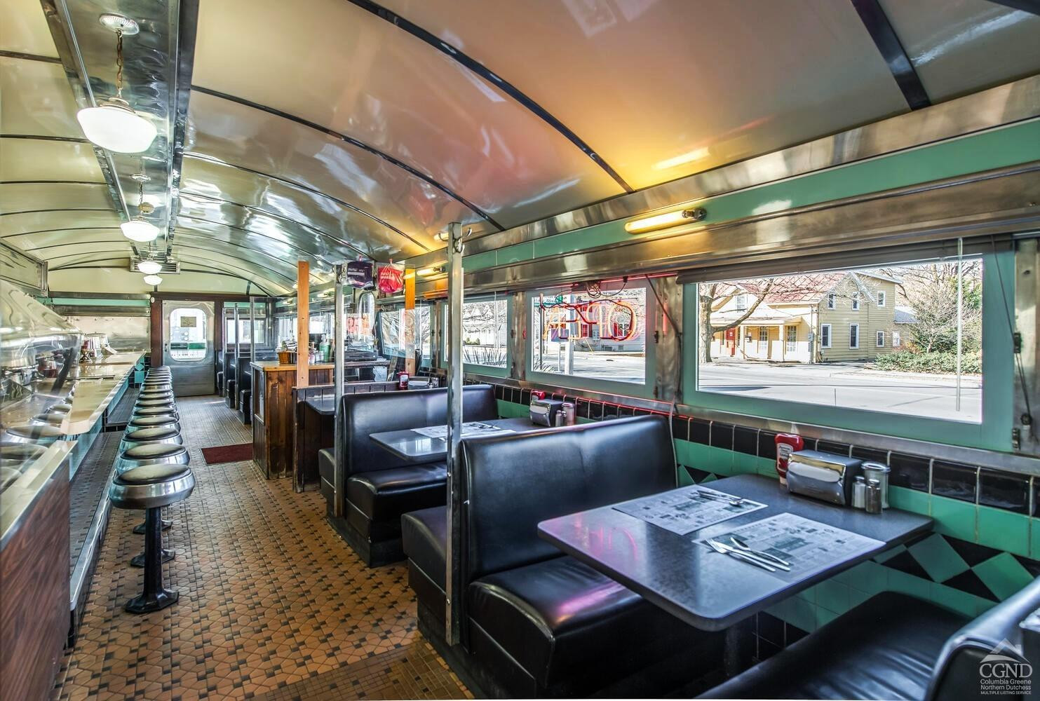7550 North Broadway Red Hook, NY 12571 - Photo 19 of 19 a living room with lots of furniture and a table