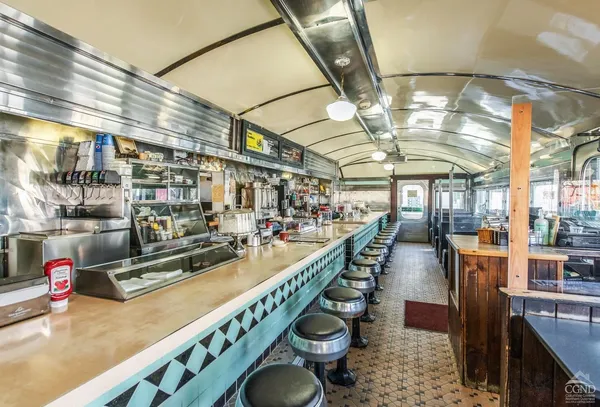 a view of a swimming pool with outdoor seating