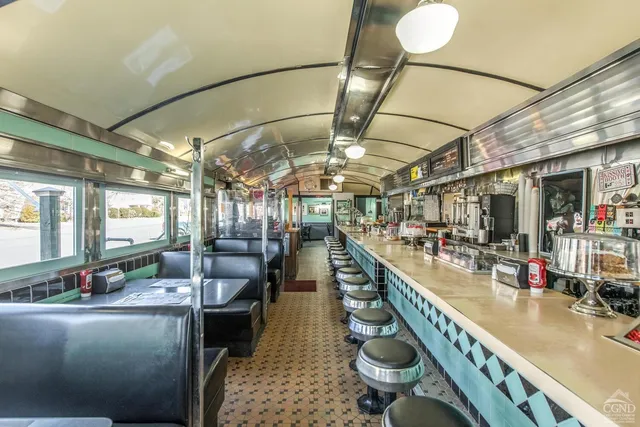 a room with lots of counter and chairs