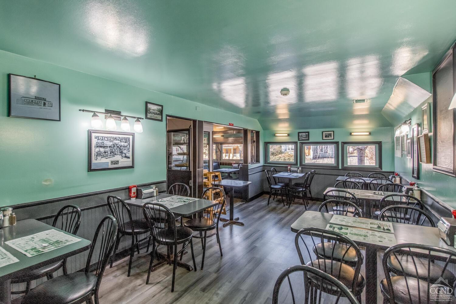 7550 North Broadway Red Hook, NY 12571 - Photo 8 of 19 a living room with furniture and a large window