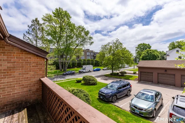 a view of a backyard with plants and a patio