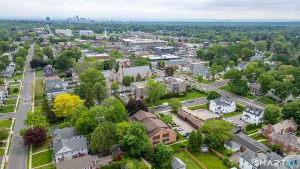 an aerial view of a city with lots of residential buildings
