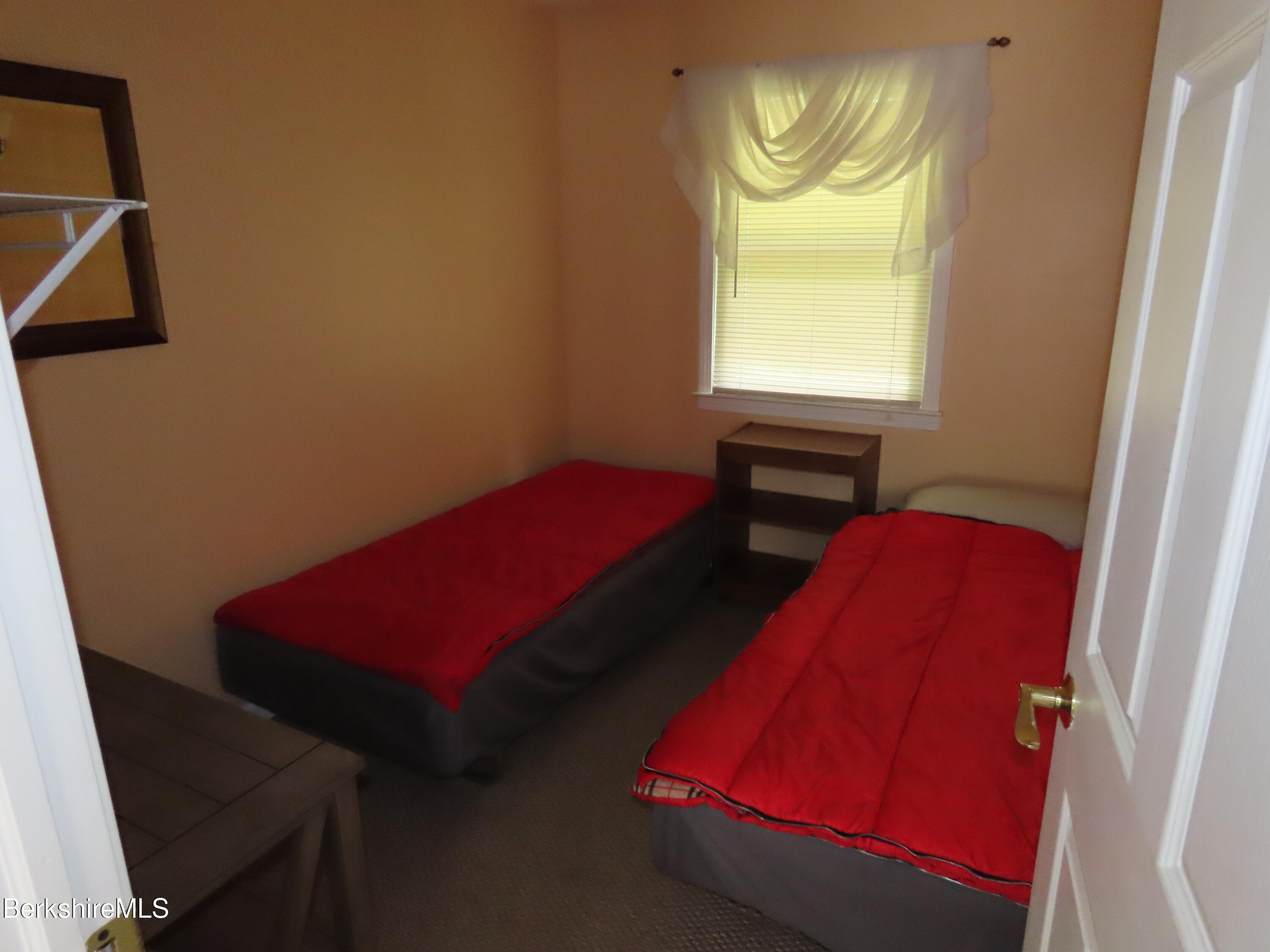 250 Magee Road Stamford, VT 05352 - Photo 15 of 35 a room with a bed and a window