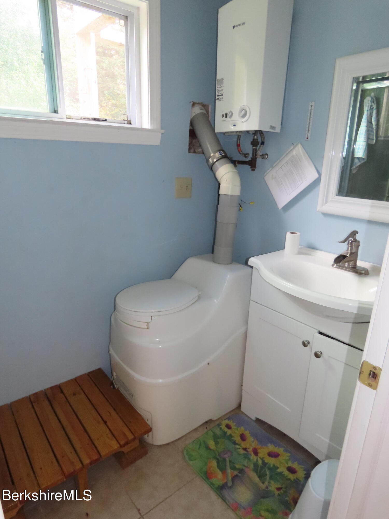 250 Magee Road Stamford, VT 05352 - Photo 19 of 35 a bathroom with a toilet and a sink