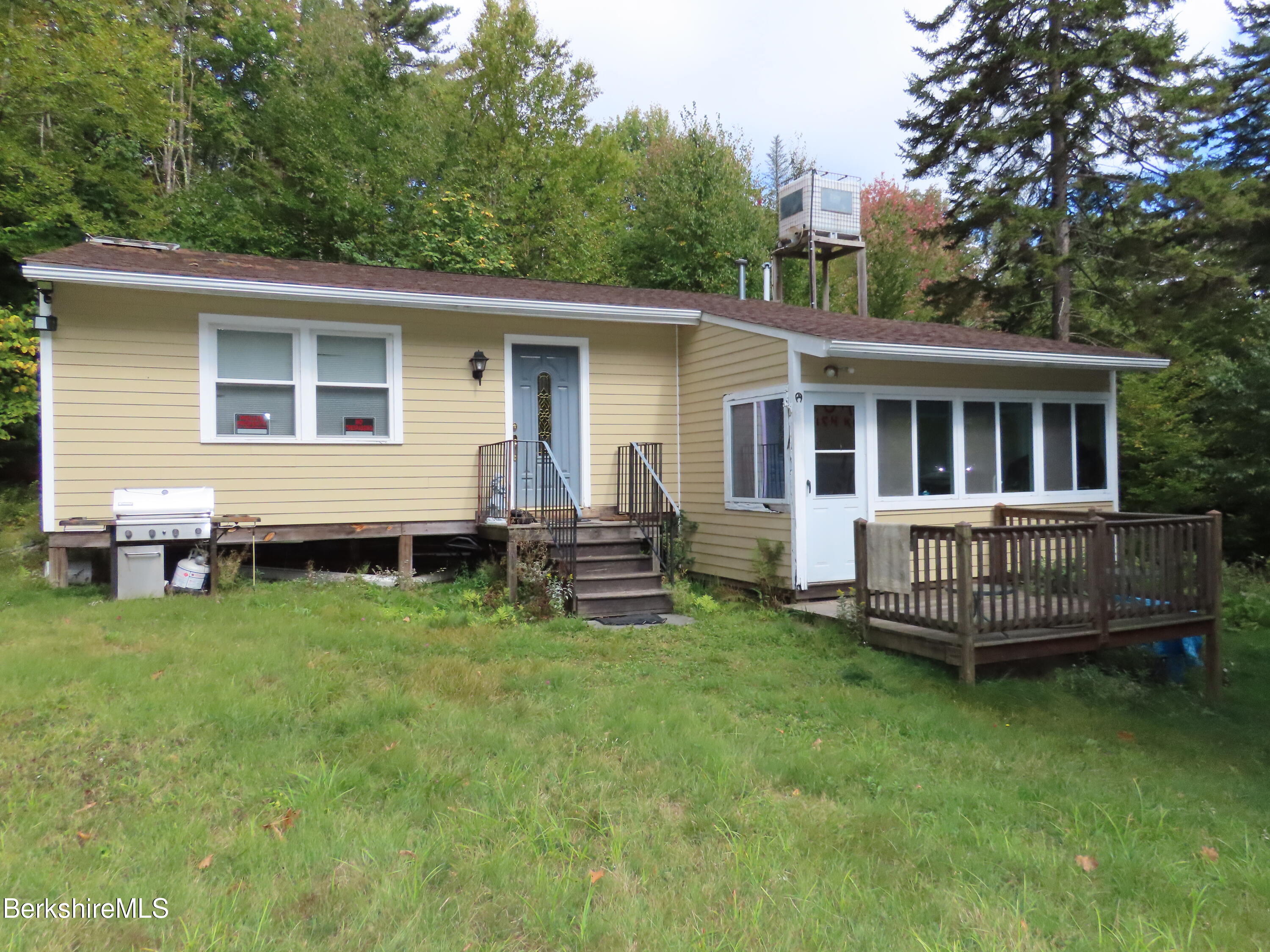 250 Magee Road Stamford, VT 05352 - Photo 2 of 35 a view of a house with a yard and deck