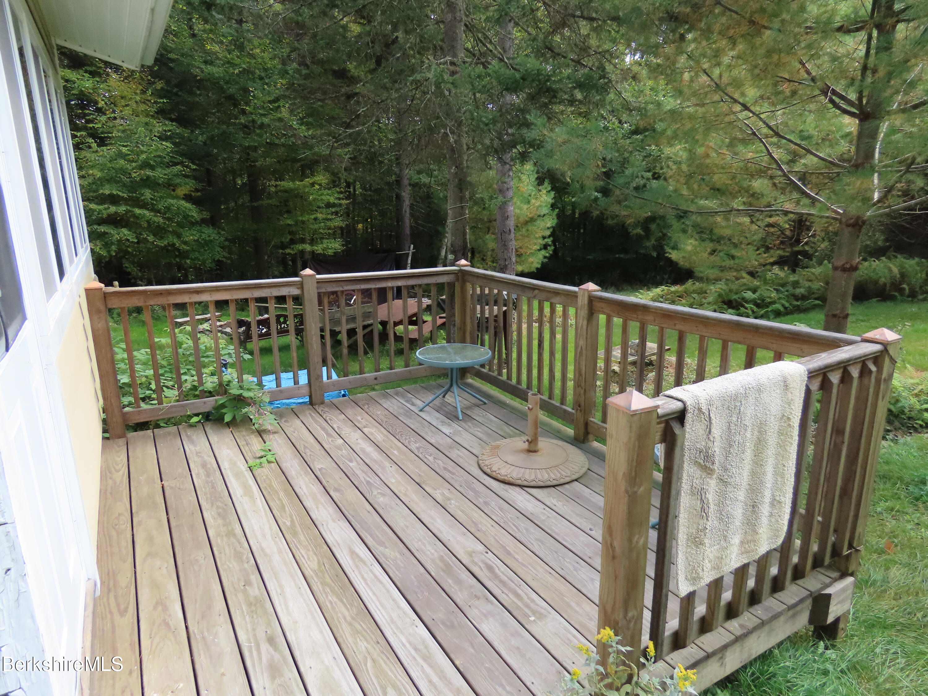 250 Magee Road Stamford, VT 05352 - Photo 21 of 35 a view of balcony with deck and wooden floor