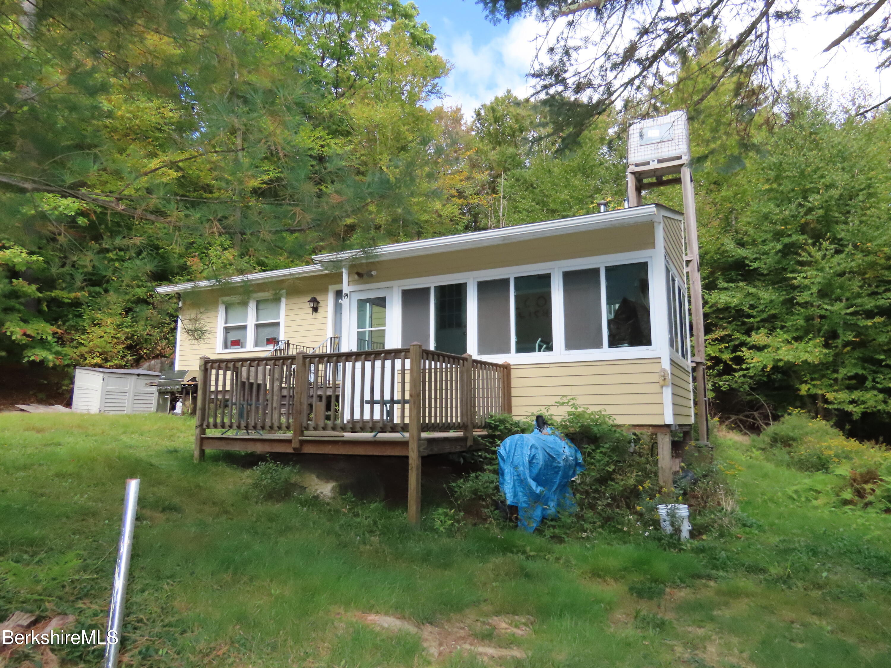 250 Magee Road Stamford, VT 05352 - Photo 28 of 35 a view of a house with a backyard and deck