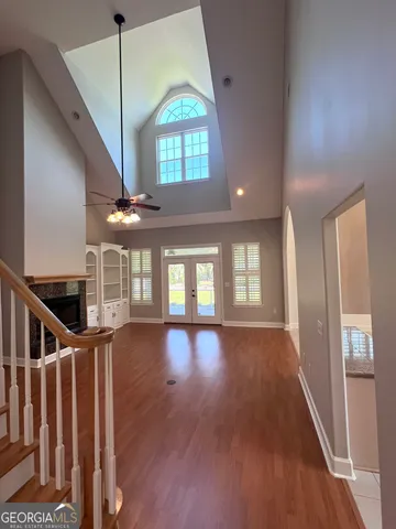 a view of an entryway with wooden floor