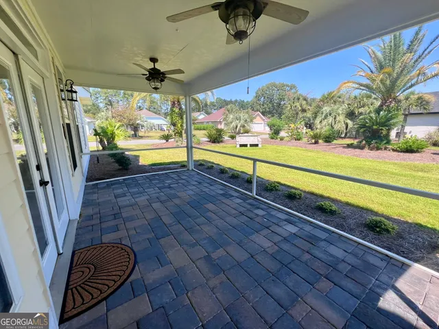 a view of a porch with a floor to ceiling windows