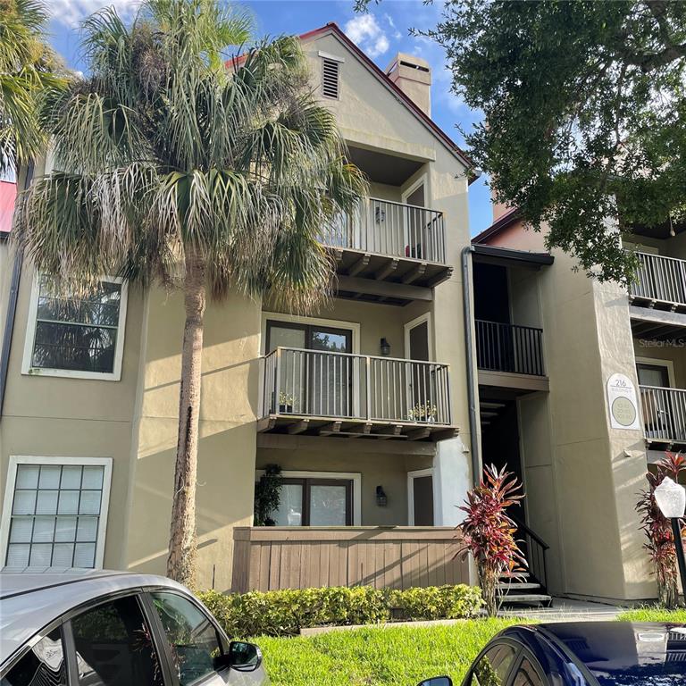 216 Afton Square, Unit 109 Altamonte Springs, FL 32714 - Photo 1 of 23 a front view of a house with a yard