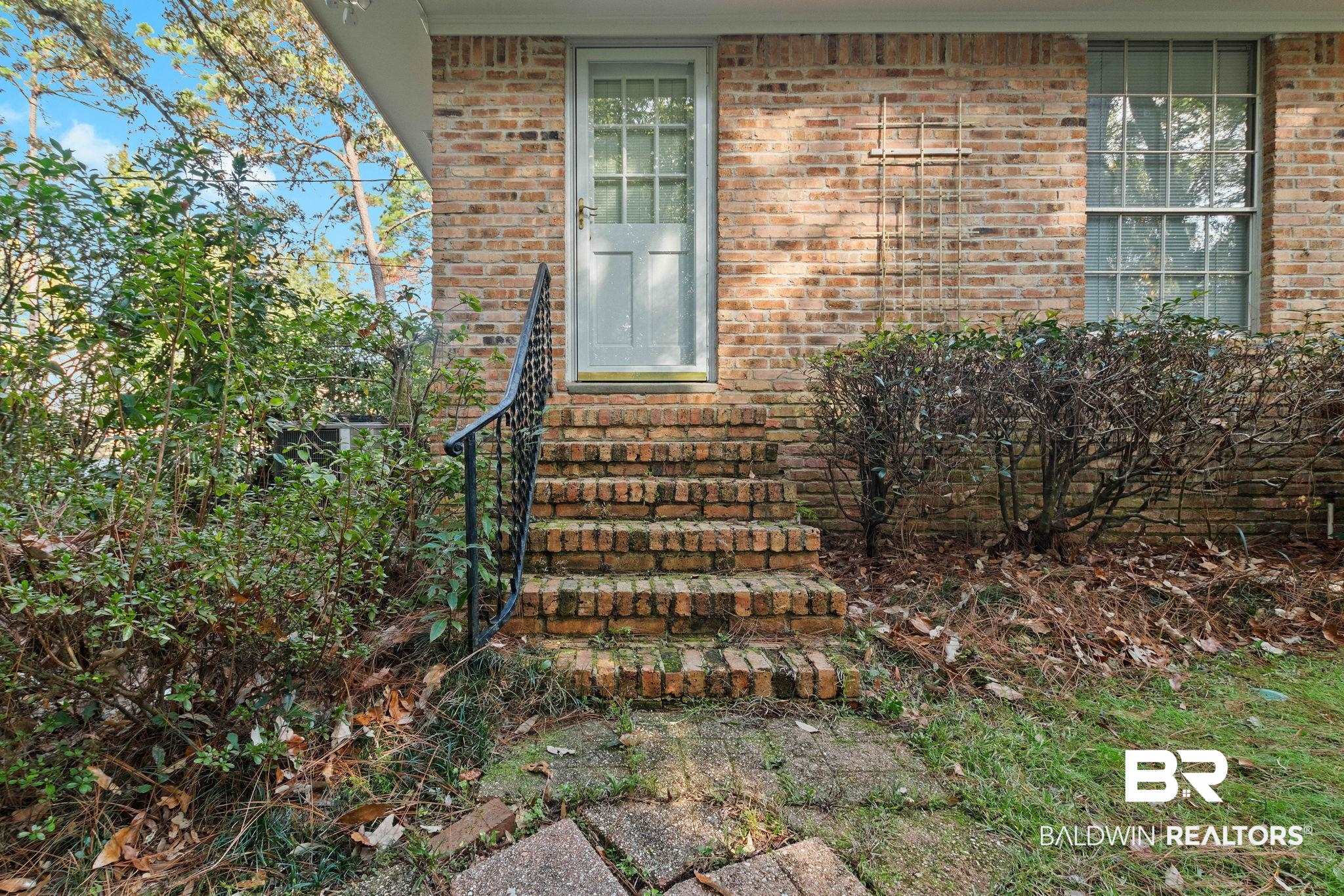 752 Evergreen Street Fairhope, AL 36532 - Photo 56 of 100 Doorway to property featuring brick siding