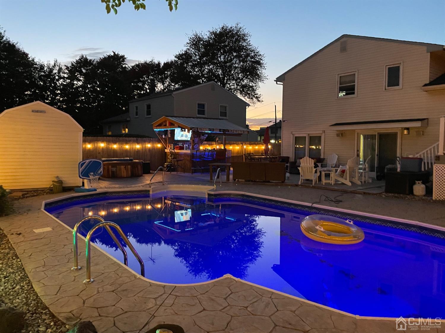 20 Outcalt Road Edison, NJ 08817 - Photo 11 of 35 a swimming pool with outdoor seating and yard