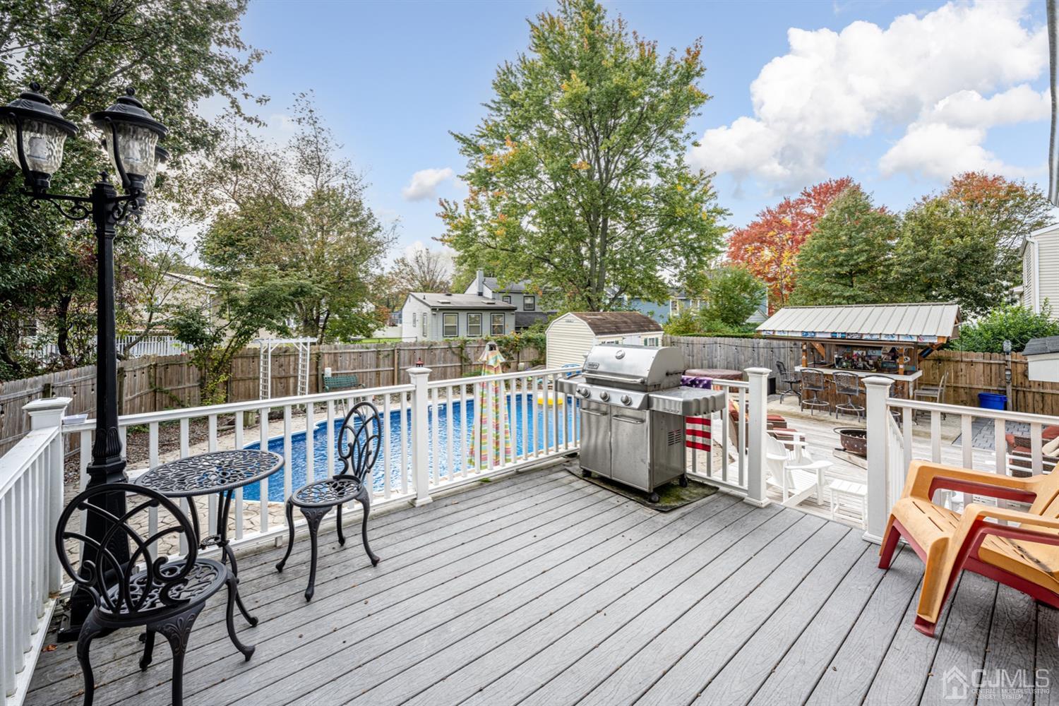 20 Outcalt Road Edison, NJ 08817 - Photo 14 of 35 a view of a deck with furniture and trees