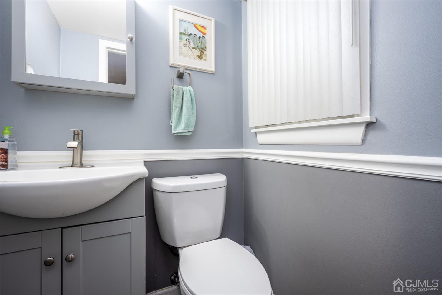 20 Outcalt Road Edison, NJ 08817 - Photo 17 of 35 a bathroom with a toilet a sink and mirror