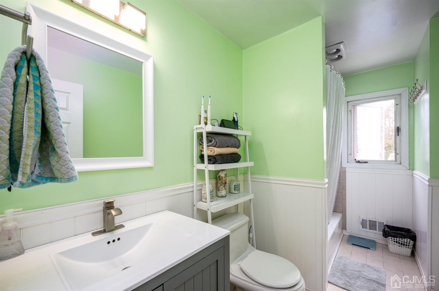 20 Outcalt Road Edison, NJ 08817 - Photo 29 of 35 a bathroom with a sink a toilet and mirror