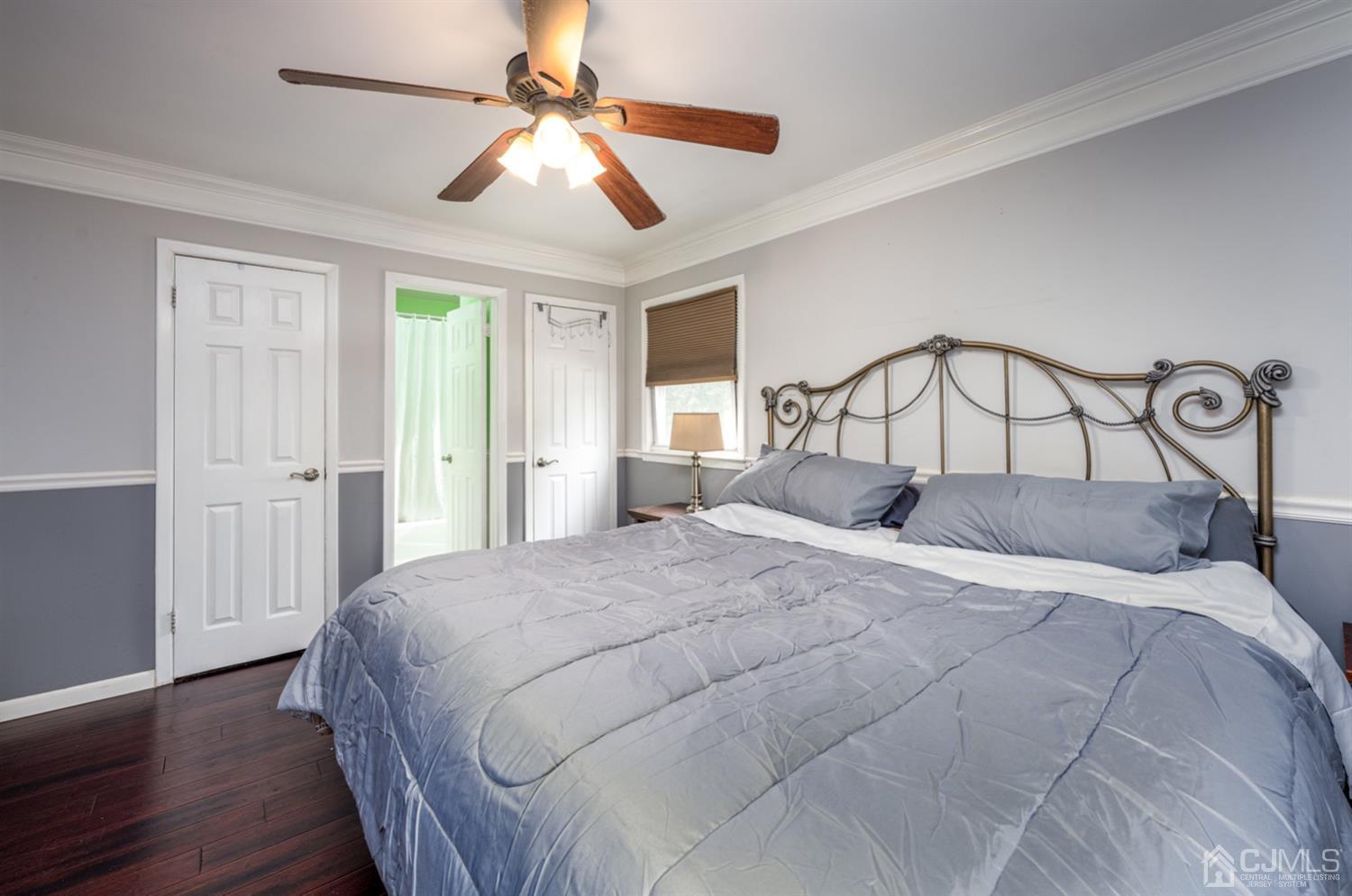 20 Outcalt Road Edison, NJ 08817 - Photo 32 of 35 a bedroom with a large bed and a chandelier