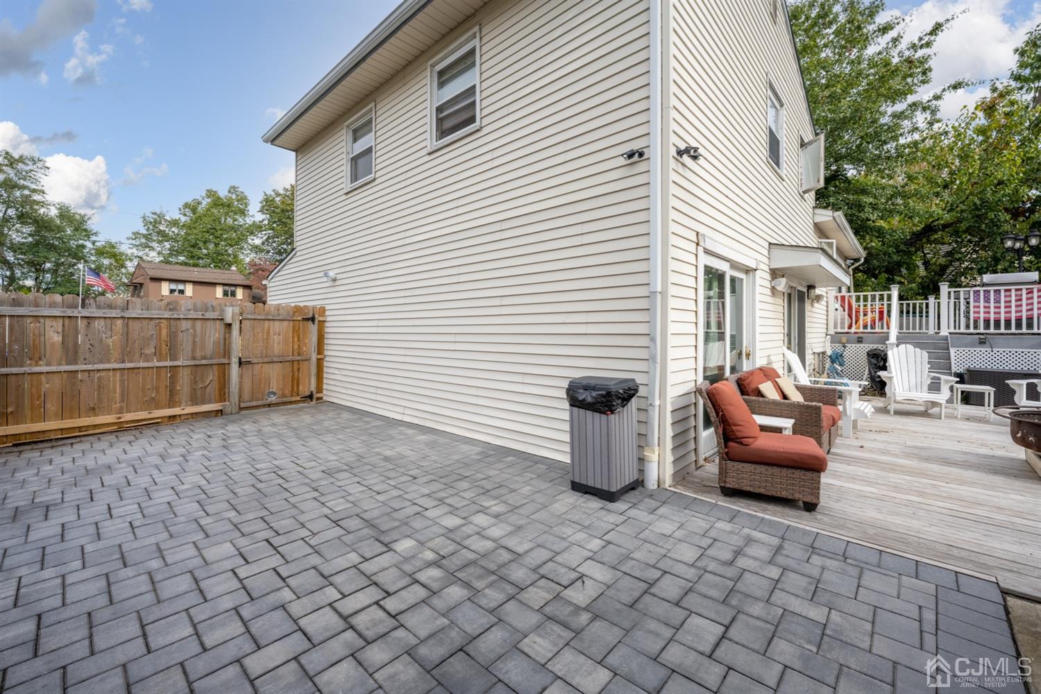 20 Outcalt Road Edison, NJ 08817 - Photo 5 of 35 a view of a patio with couches and table and chairs with wooden fence
