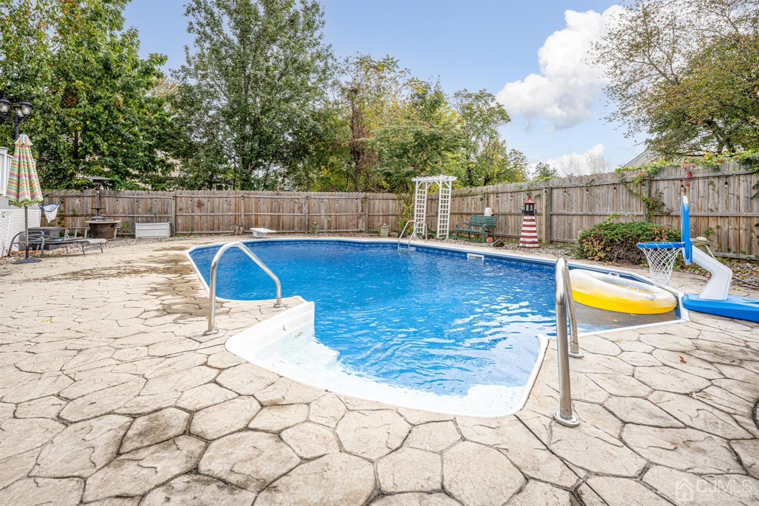 20 Outcalt Road Edison, NJ 08817 - Photo 6 of 35 a view of a swimming pool with a lounge chair