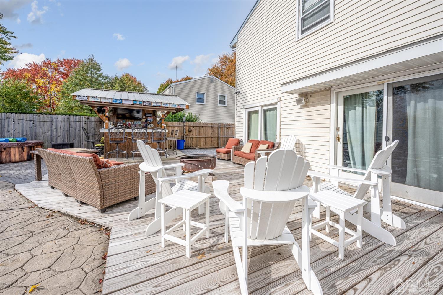20 Outcalt Road Edison, NJ 08817 - Photo 7 of 35 a view of a patio with table and chairs with wooden floor and fence