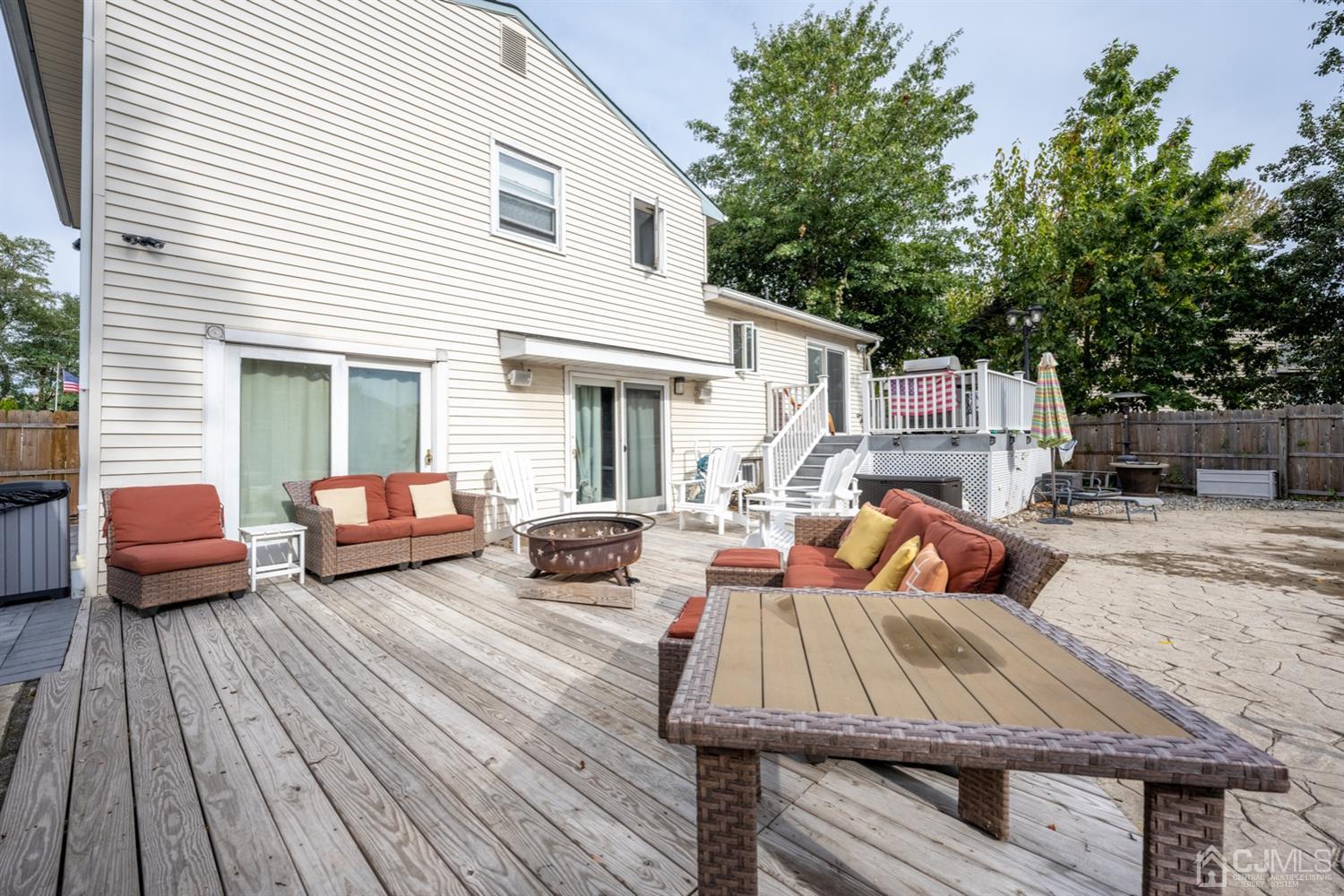 20 Outcalt Road Edison, NJ 08817 - Photo 8 of 35 a view of a patio with wooden floor and a table and chairs
